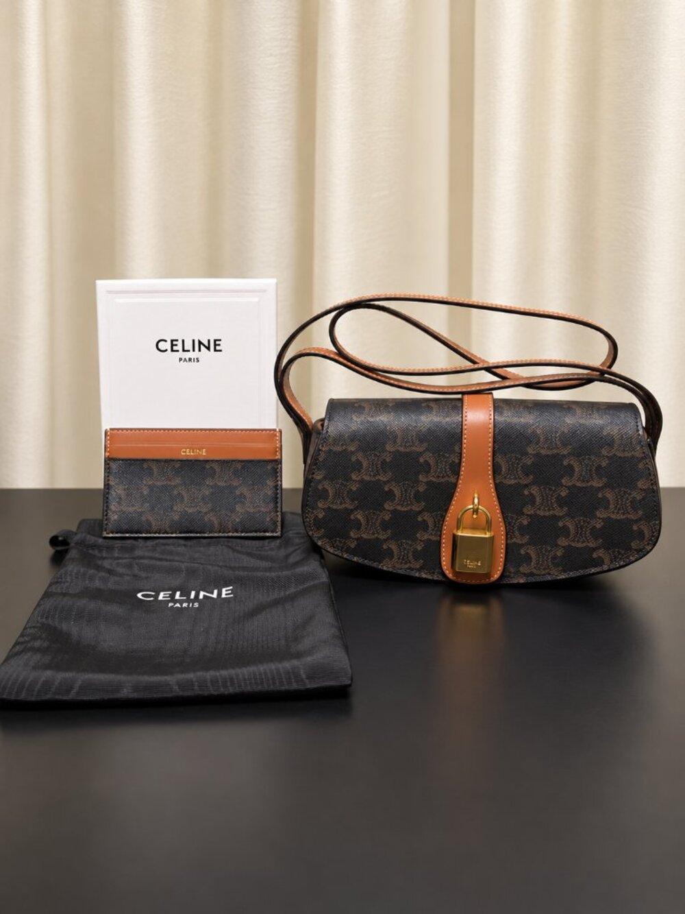 Celine Triomphe Tabou Clutch on Strap includes cardholder